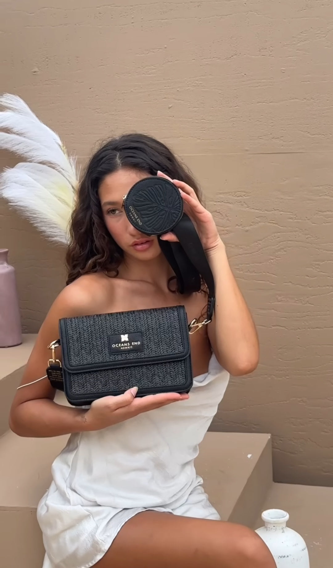 Oceans End Giovanni crossbody bag with embossed Pikake lei detail