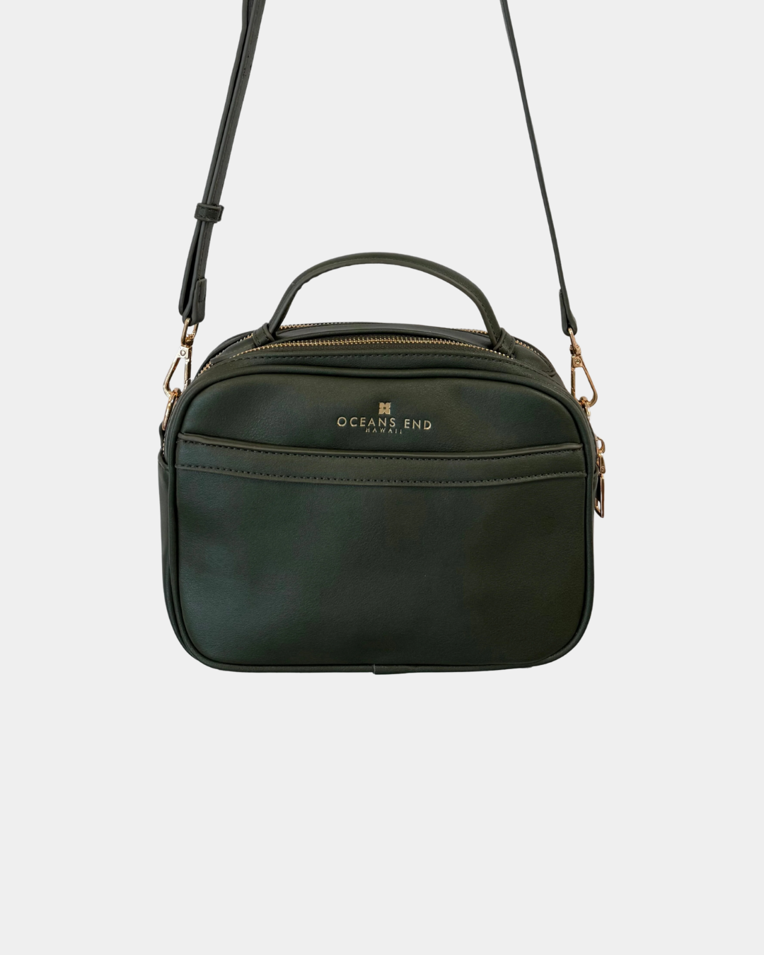 Back view of the Oceans End Justine 2.0 emerald crossbody bag featuring a convenient exterior slip pocket, top handle, and adjustable shoulder strap.