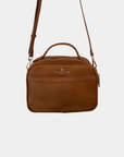 Back view of the Oceans End Justine 2.0 saddle crossbody bag featuring a convenient exterior slip pocket, top handle, and adjustable shoulder strap.
