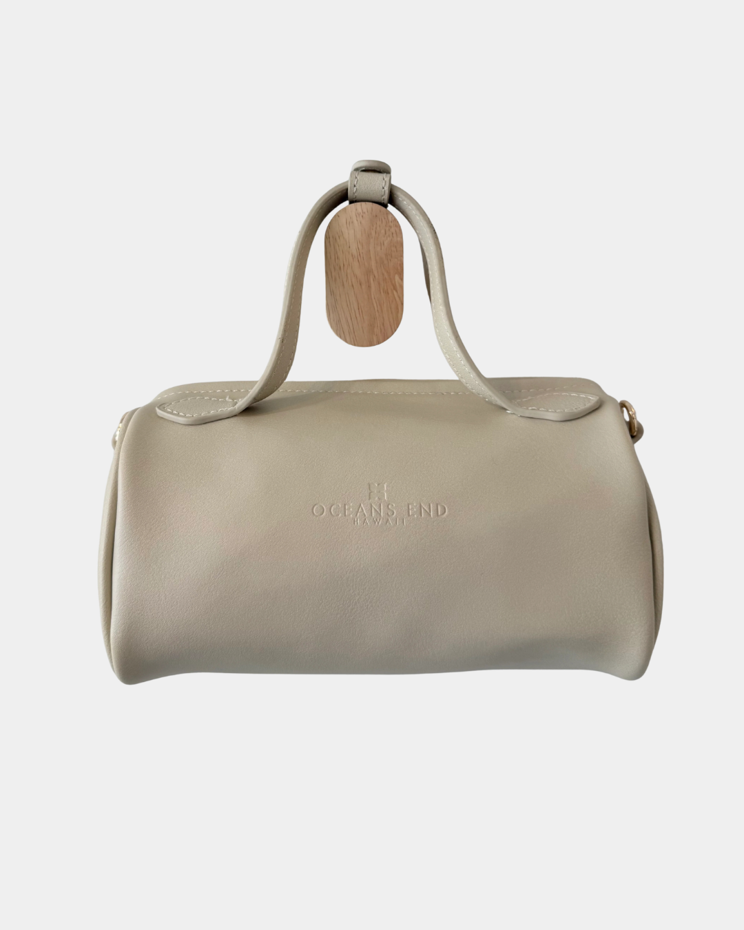Back view of the Oceans End Lehua convertible handbag in creme vegan leather