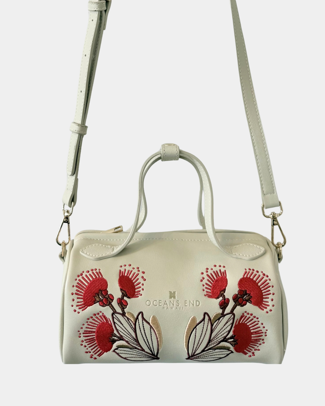 Oceans End Lehua convertible handbag in creme with removable crossbody strap and lehua flower embroidery