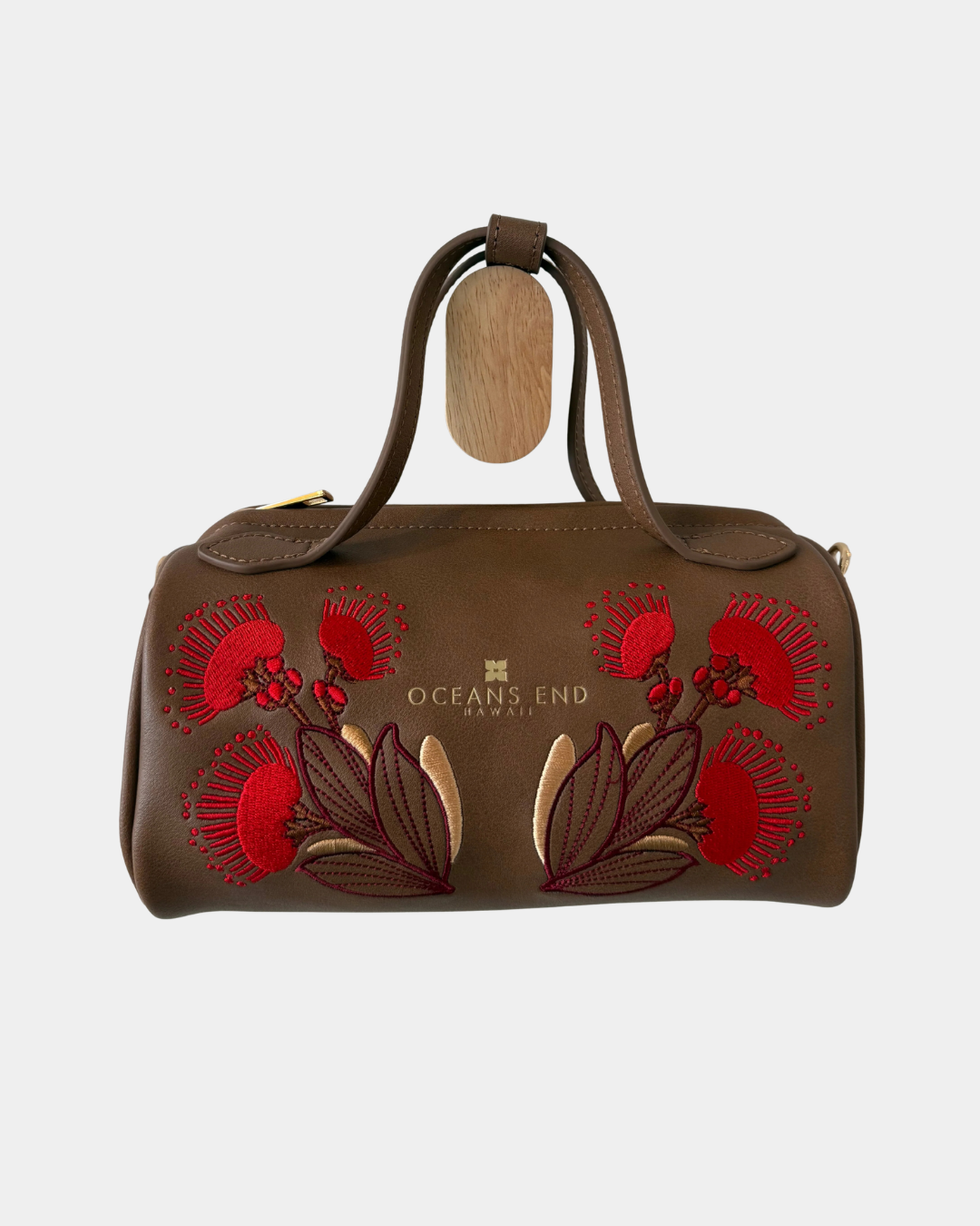 Oceans End Lehua convertible handbag in mocha vegan leather with embroidered lehua flowers and top handles