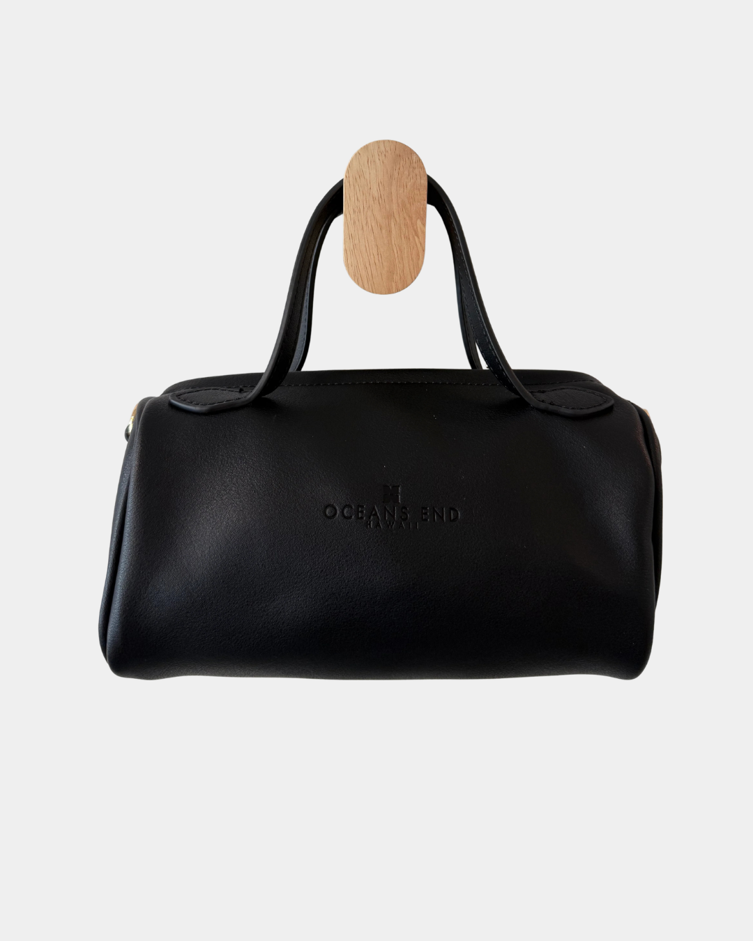 Back view of the Oceans End Lehua convertible handbag in onyx vegan leather