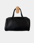 Back view of the Oceans End Lehua convertible handbag in onyx vegan leather