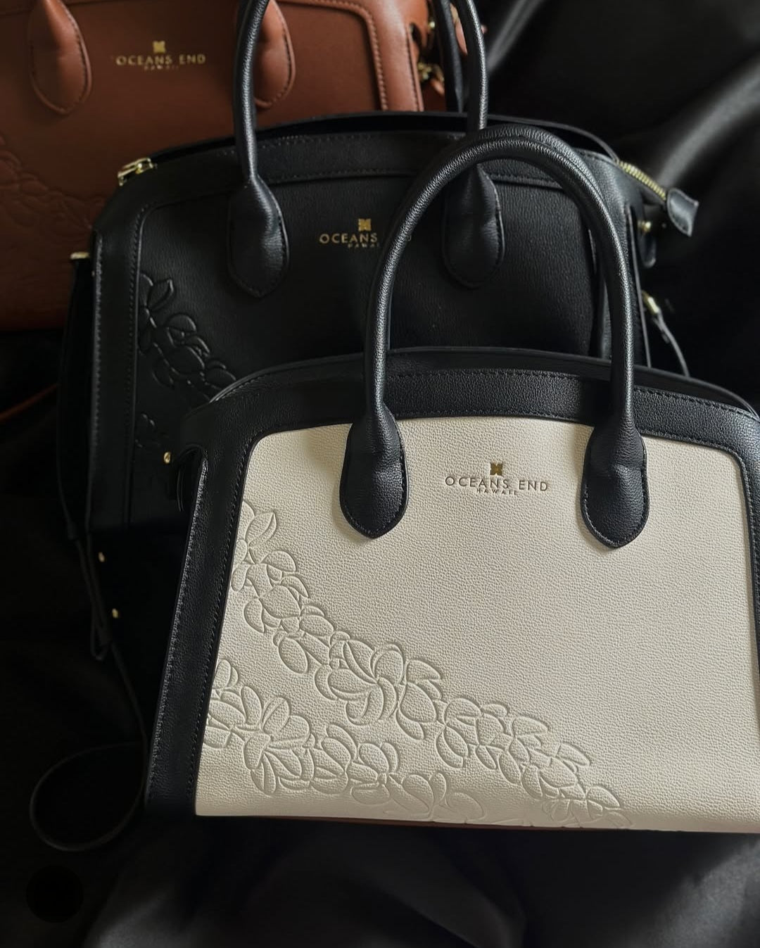 Oceans End Leialoha handbag with embossed puakenikeni lei design