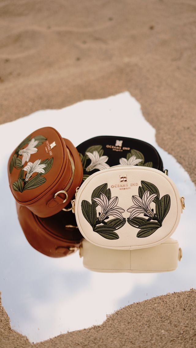 Oceans End Naupaka crossbody bag with embroidered floral design