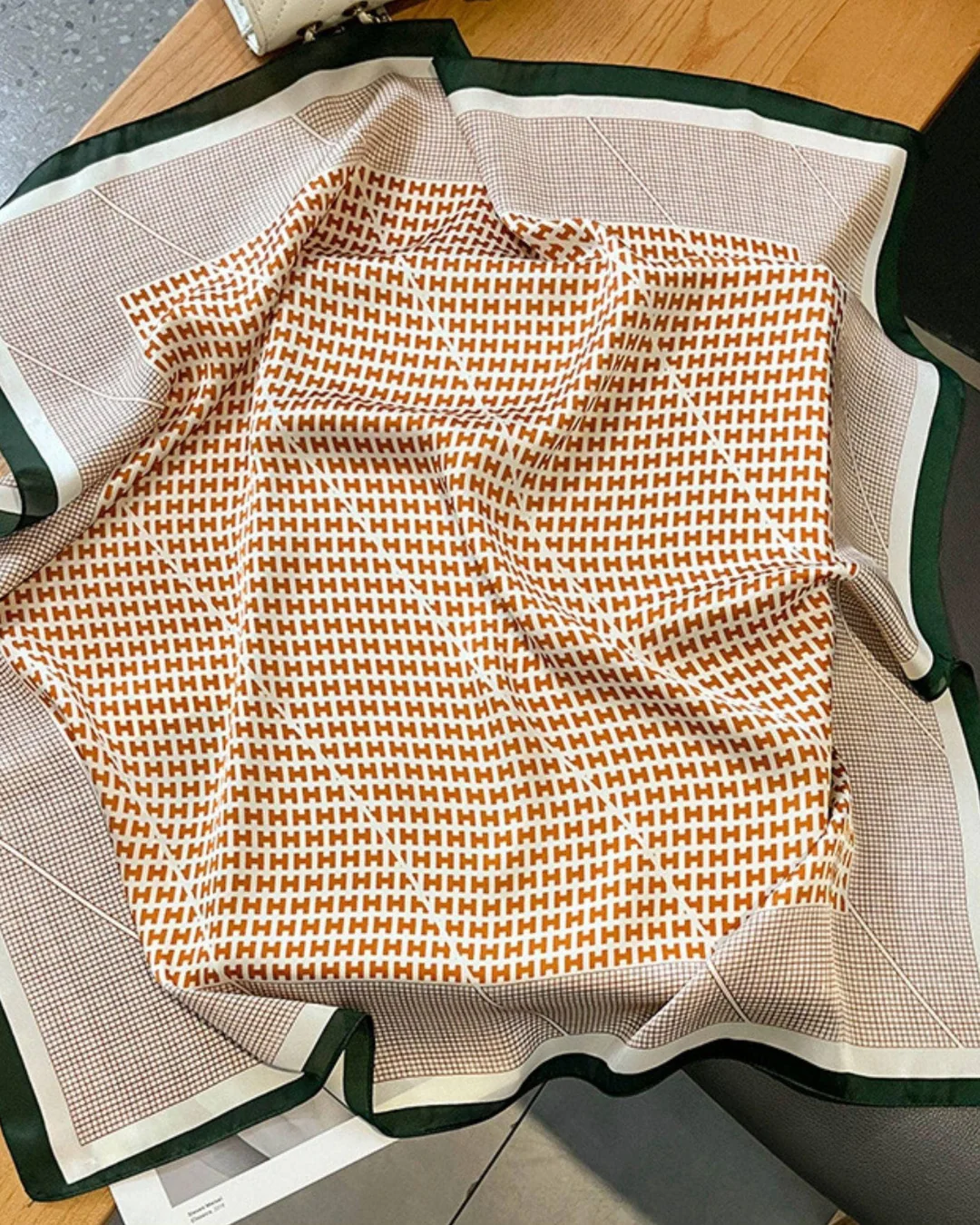 Orange plaid mulberry silk scarf flat lay showing classic plaid pattern