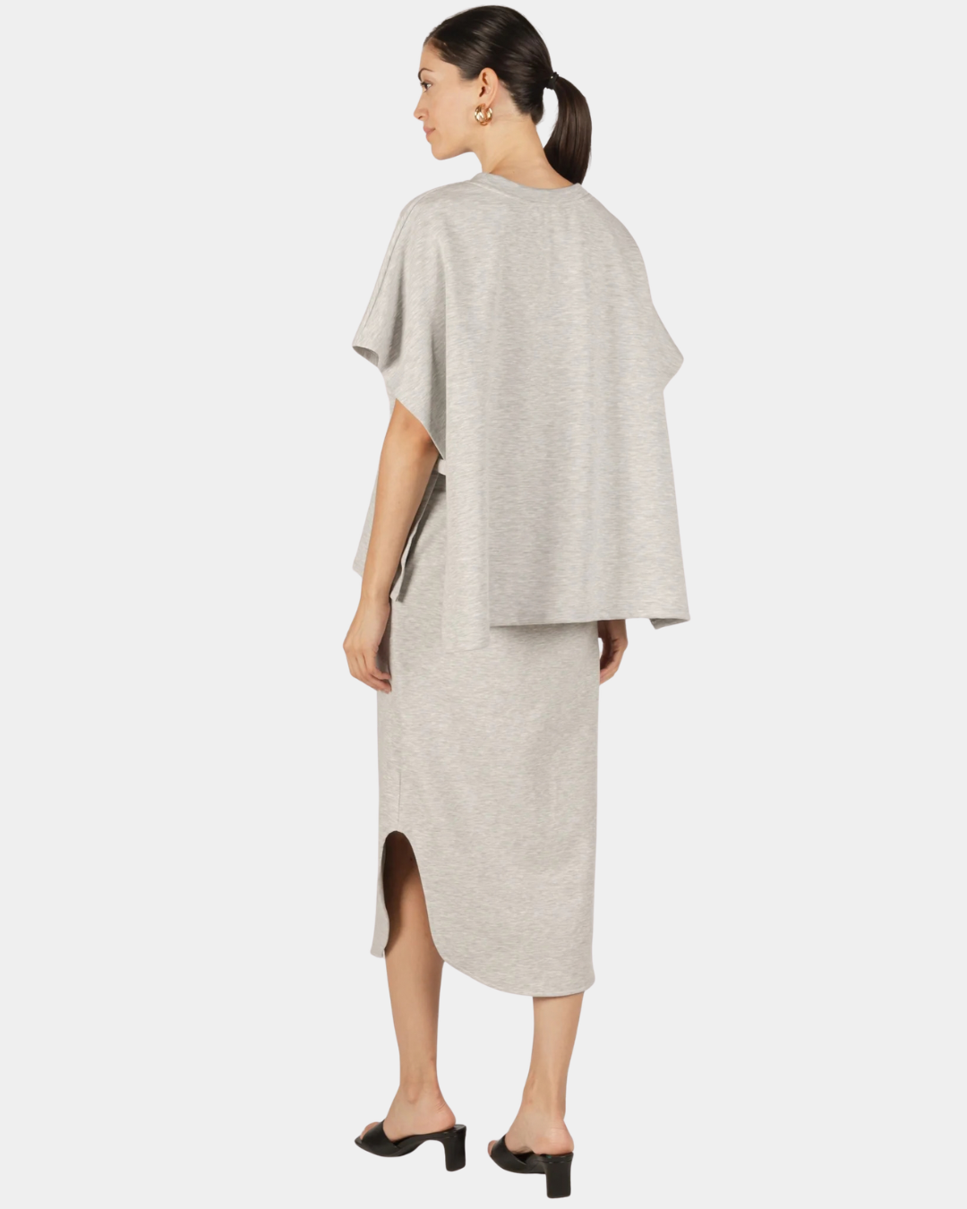 Back view of the P.CILL Diana Butter Modal Midi Skirt in Heather Grey showing the side slit