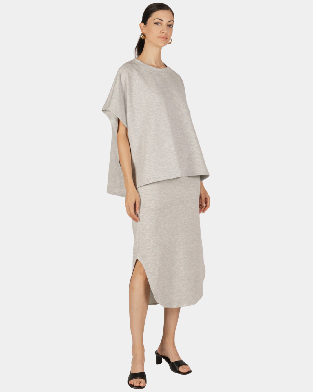 Front view of the P.CILL Diana Butter Modal Midi Skirt in Heather Grey styled with a coordinating top