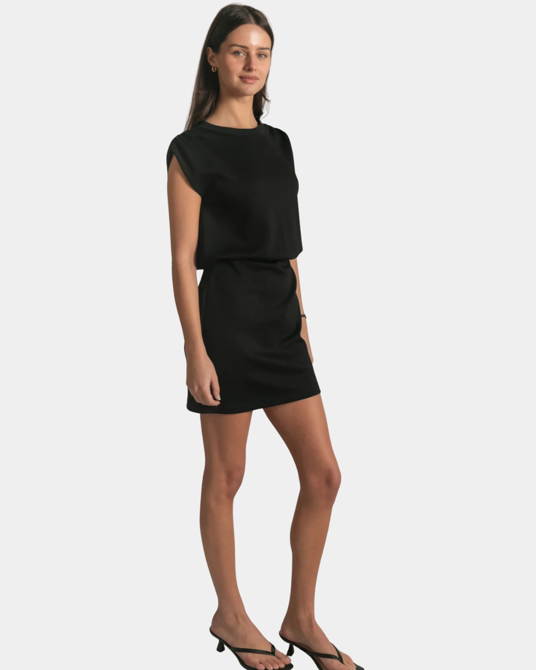 Side view of the P.CILL Kai Butter Modal Mini Dress in Black styled on model
