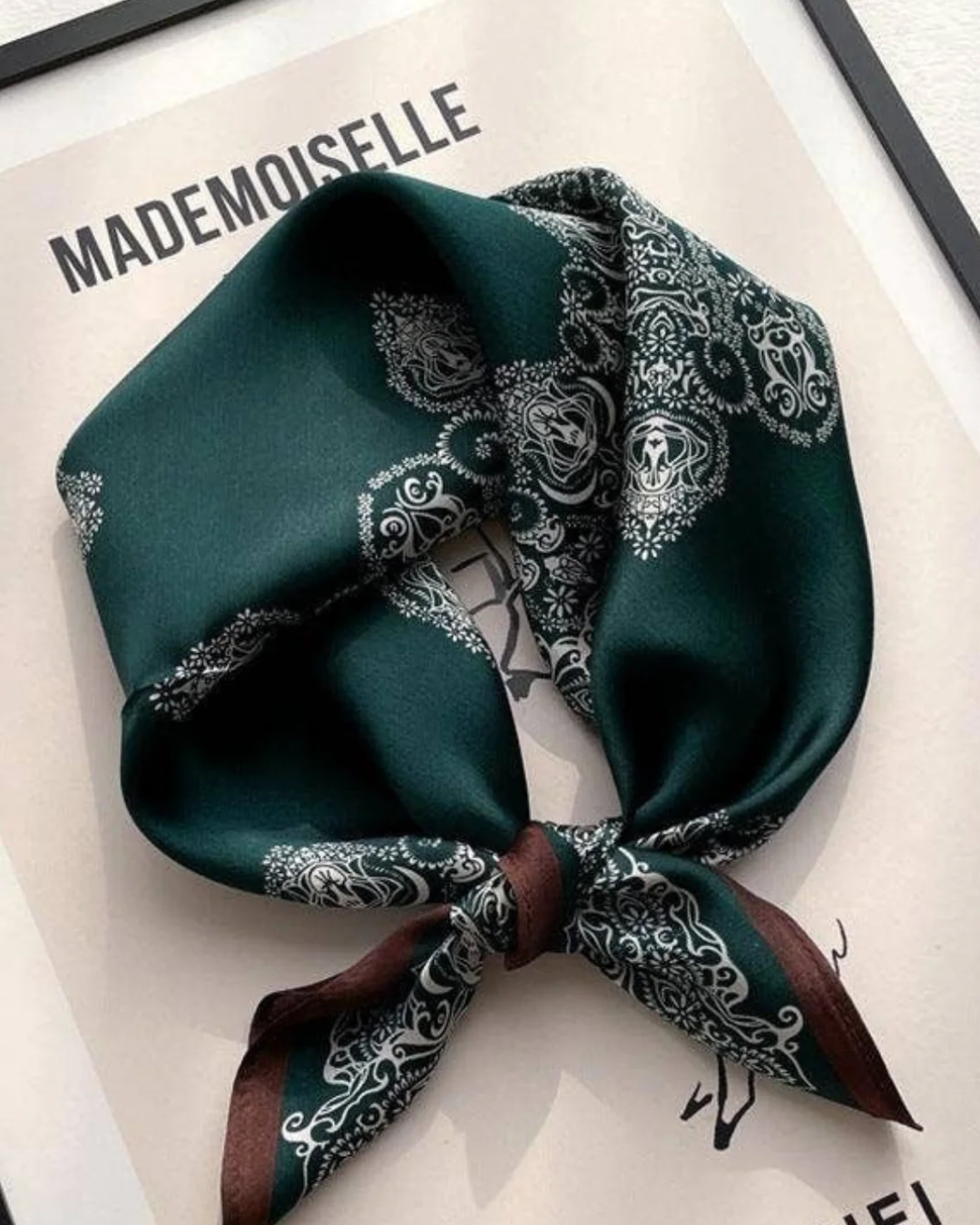 Painted totems mulberry silk scarf styled around the neck