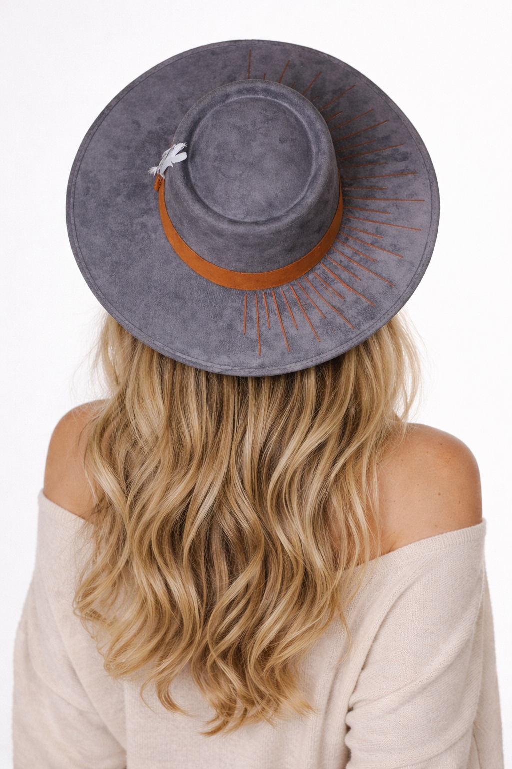 The Camaleon Bolero Hat styled on a model for a bold, elevated fashion look.