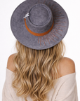 The Camaleon Bolero Hat styled on a model for a bold, elevated fashion look.