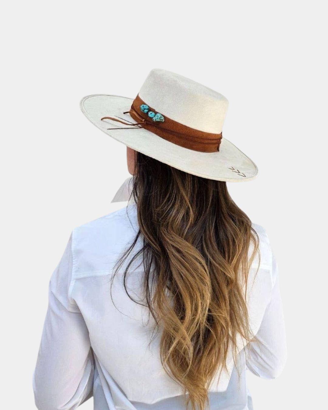 The Petra Savage Tasha Boater Hat styled on a model in neutral fashion styling.