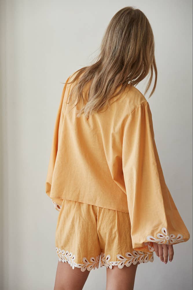 Resort embroidered puff sleeve top back view showing silhouette and fabric detail