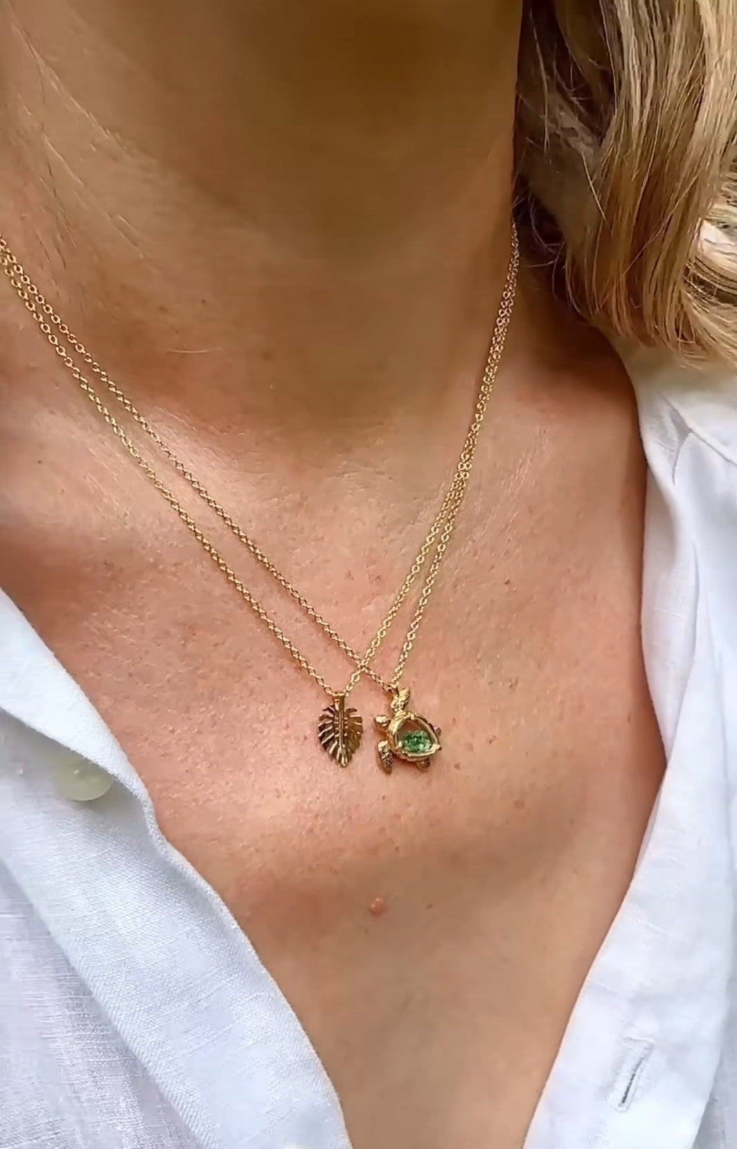 Handcrafted sea turtle shaker necklace on model