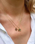 Handcrafted sea turtle shaker necklace on model