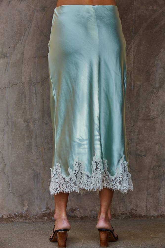 Back view of Silk Drift Skirt highlighting smooth satin fabric and clean, flowing silhouette
