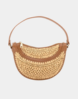 Close-up of handwoven raffia texture and leather trim on the Solstice half moon convertible bag.