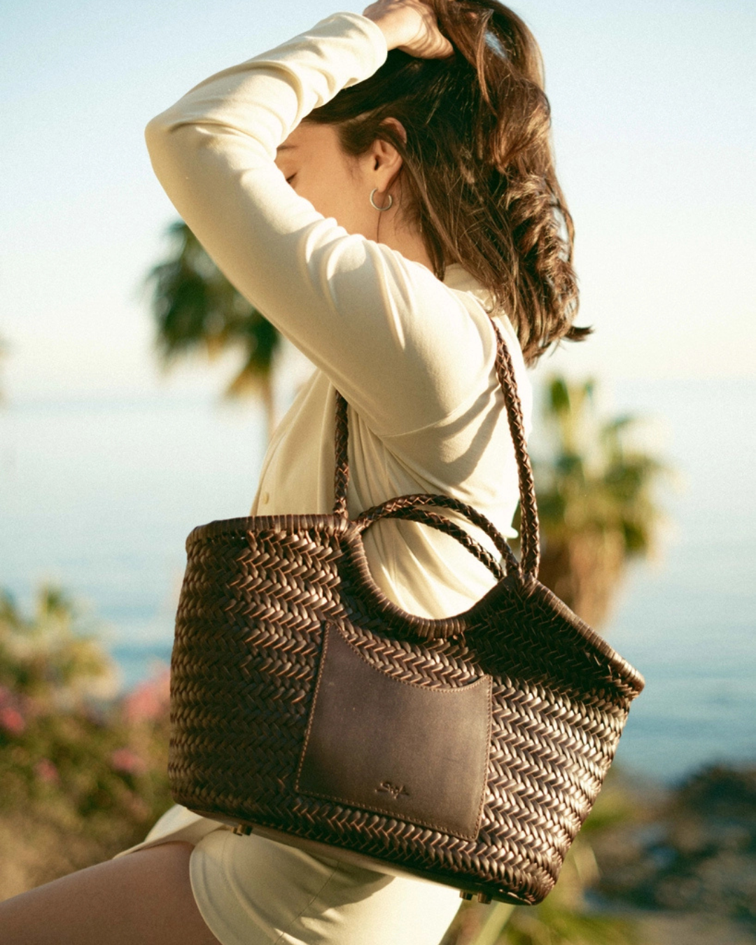 The Celia artisan woven leather tote by Sook Sustainable styled for everyday wear with an elevated, relaxed look.