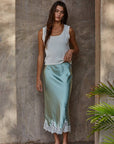 Woman wearing Sunwashed Knit Tank with Silk Drift Skirt in a soft, elevated summer outfit