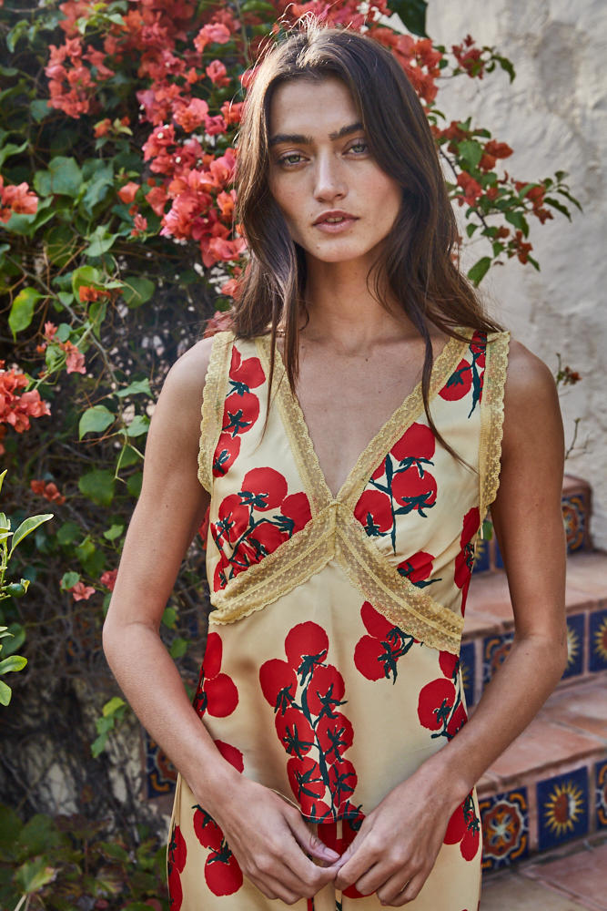 Close-up detail of the lace trim and satin fabric on the Vine Rouge sleeveless blouse.