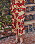 Front view of the Vine Rouge satin skirt featuring a tomato vine print and fluid drape.