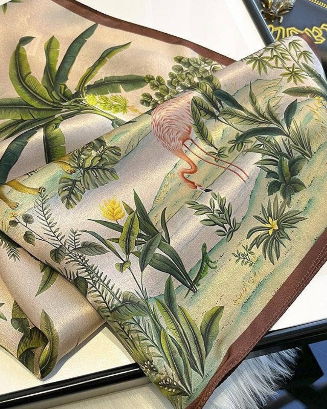 Vintage jungle animals luxury mulberry silk scarf flat lay showing colorful wildlife pattern